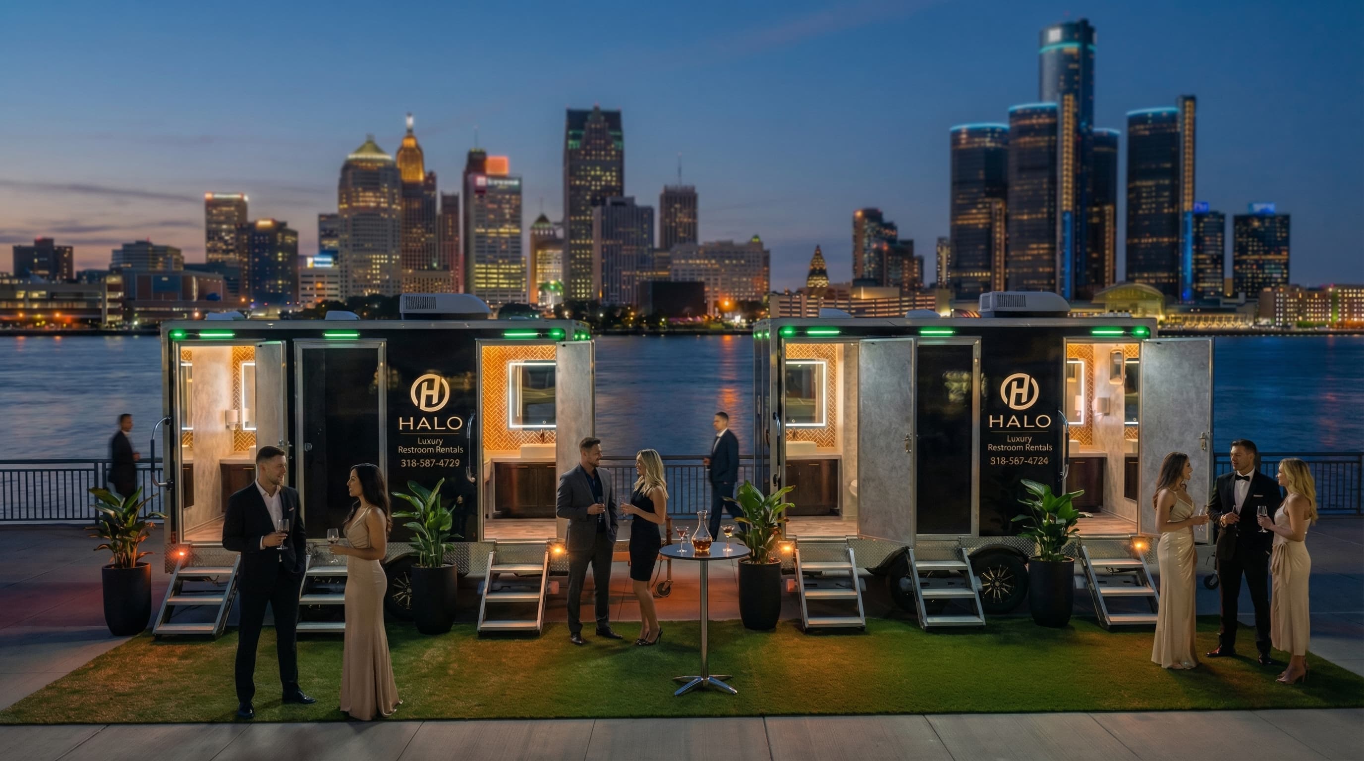 Luxury portable restroom trailers at a formal waterfront event with a city skyline backdrop.